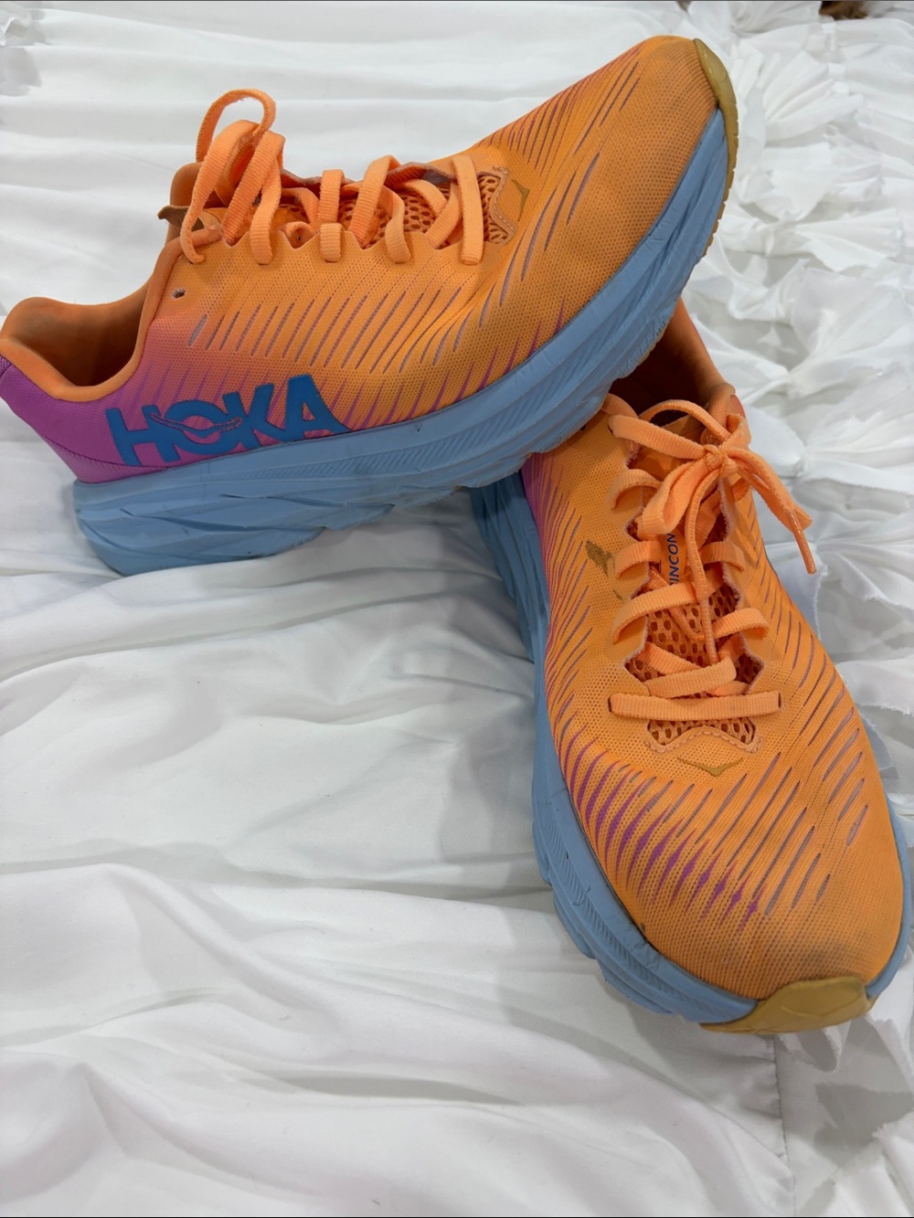 Hoka Women's Orange Running Shoes with Blue Soles